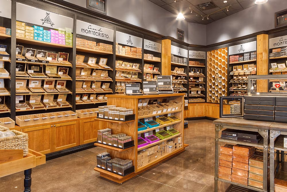 Interior of a Casa de Montecristo cigar store with many cigar boxes.