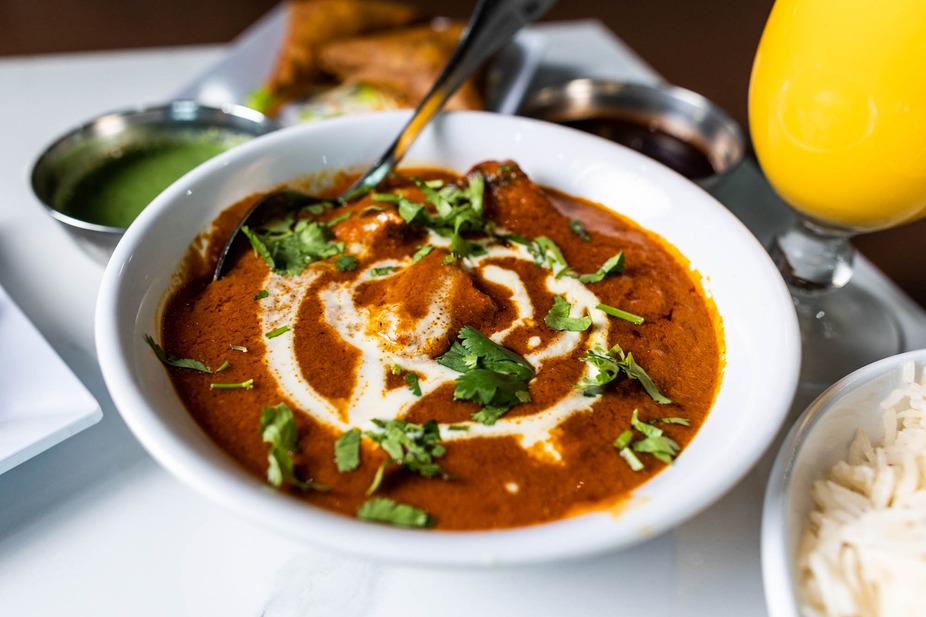 Indian chicken curry with cream and cilantro, served with rice.