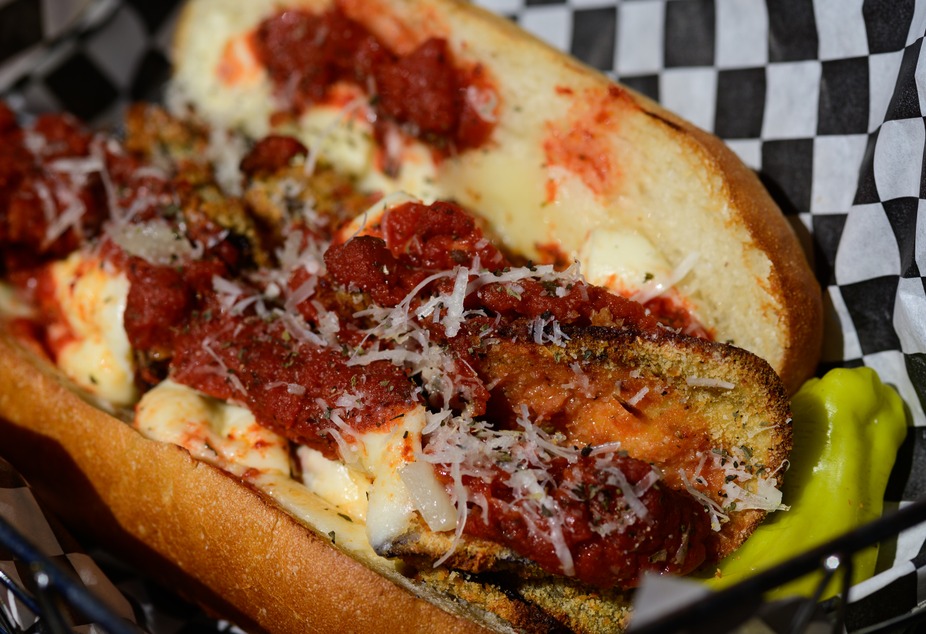 Eggplant parmesan sub sandwich with marinara, melted cheese, and parmesan.