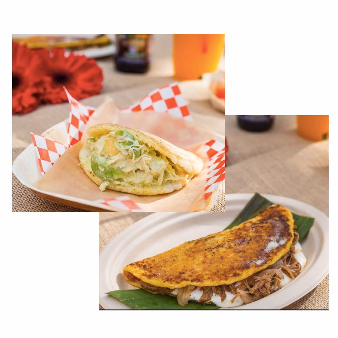 Arepa and cachapa on plates, with fillings, in an outdoor setting.