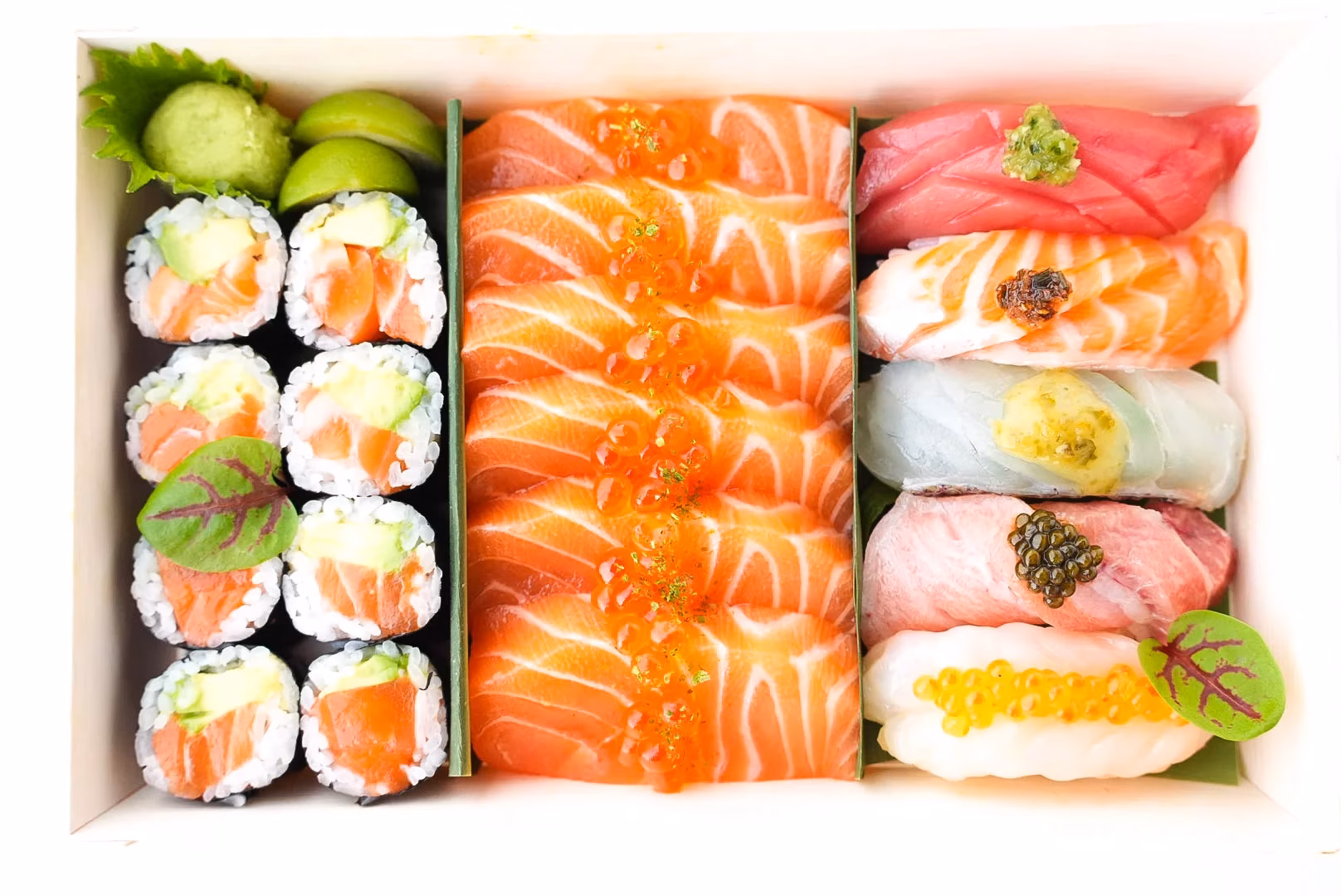 Assorted sushi and sashimi, including salmon, tuna, and maki rolls.