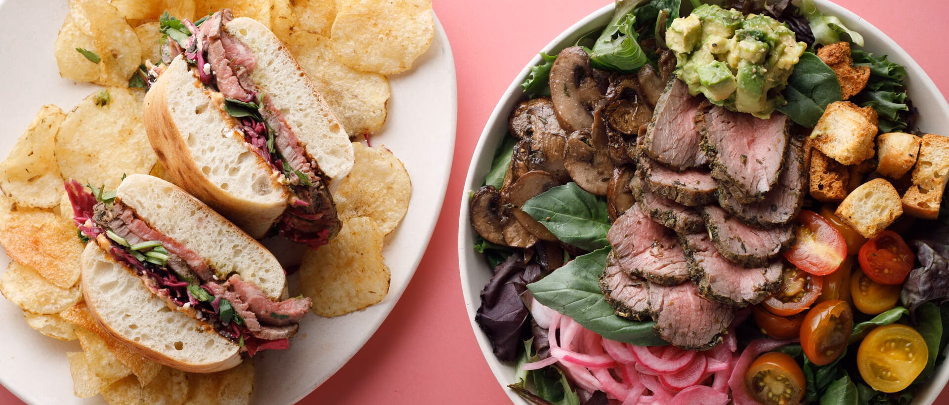 Sandwich with sliced meat and chips, alongside a steak salad.