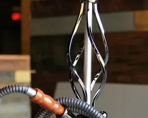 Polished silver hookah stem with twisted design and grey hose.