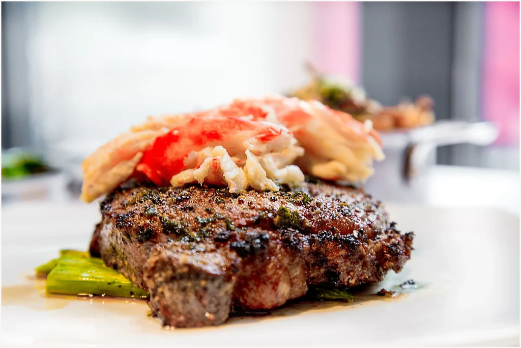 Thick seared steak, succulent crab meat, and bright green asparagus.