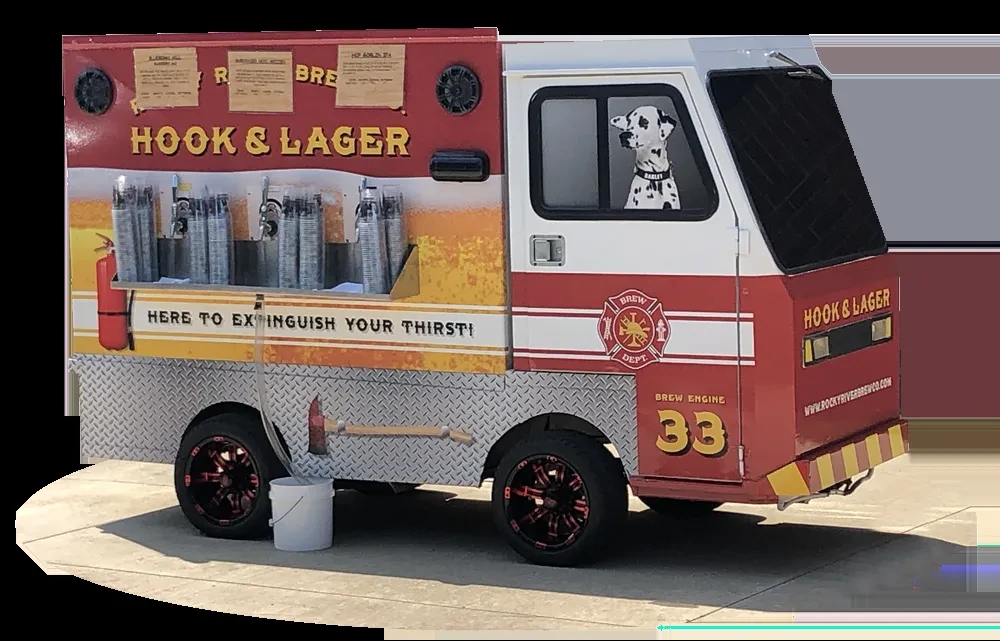 Red and white fire engine beverage truck with a Dalmatian dog.