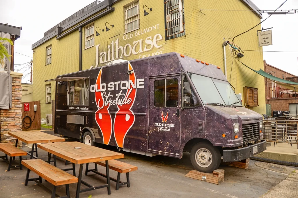 "OLD STONE" food truck parked near "OLD BELMONT Jailhouse."