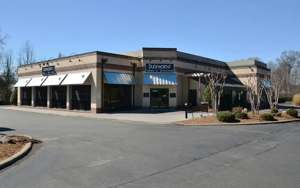 Exterior of Duckworth's Grill & Taphouse building with brick and awnings.