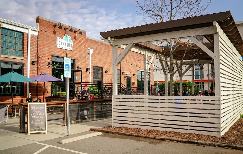 Lenny Boy Brewing Co. exterior, busy outdoor patio with live music.