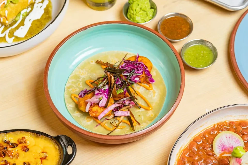 Vibrant overhead view of a Mexican food spread with a fish taco.