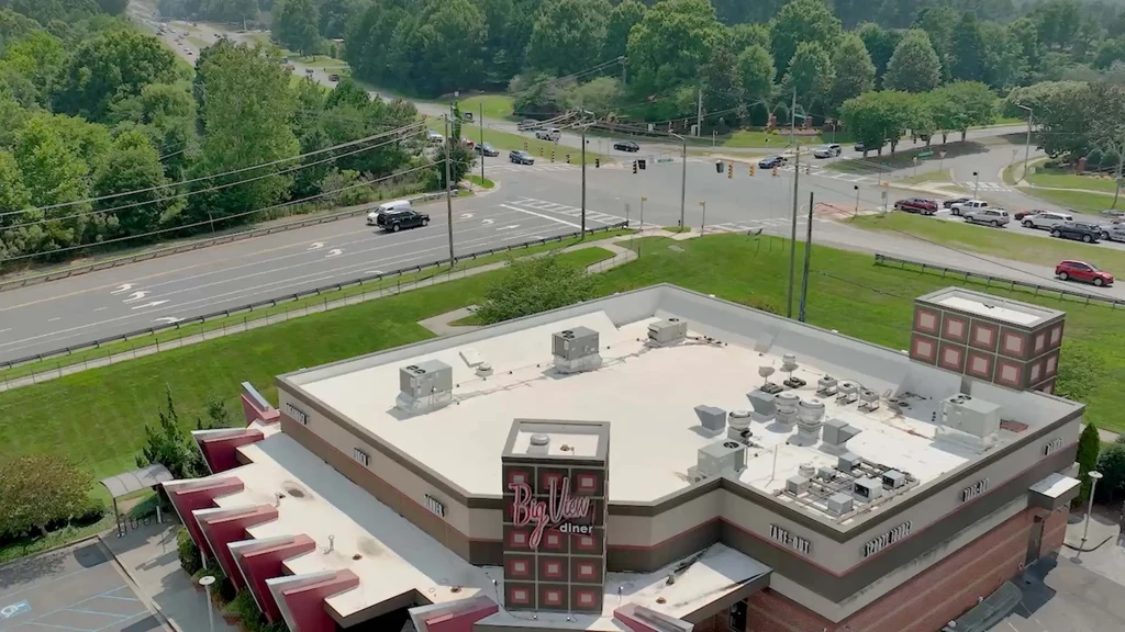 Overhead view of Bay View Diner, retro sign, multi-lane highway.