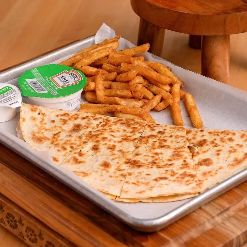 Cheese quesadilla, french fries, salsa, and sour cream on a tray.