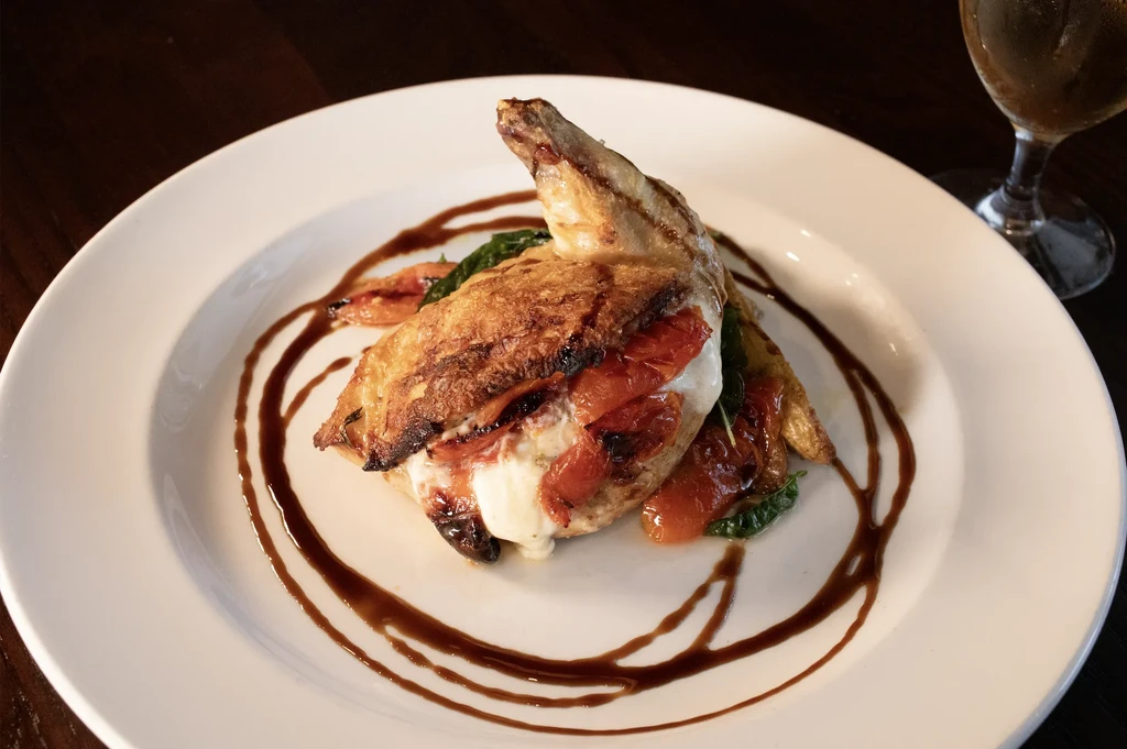 Grilled chicken/fish with melted cheese, roasted tomatoes, spinach, balsamic glaze.