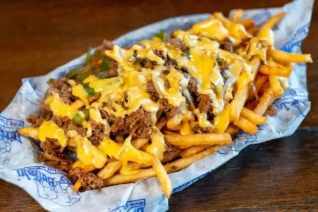 Loaded French fries with beef, melted cheese, and bell peppers.