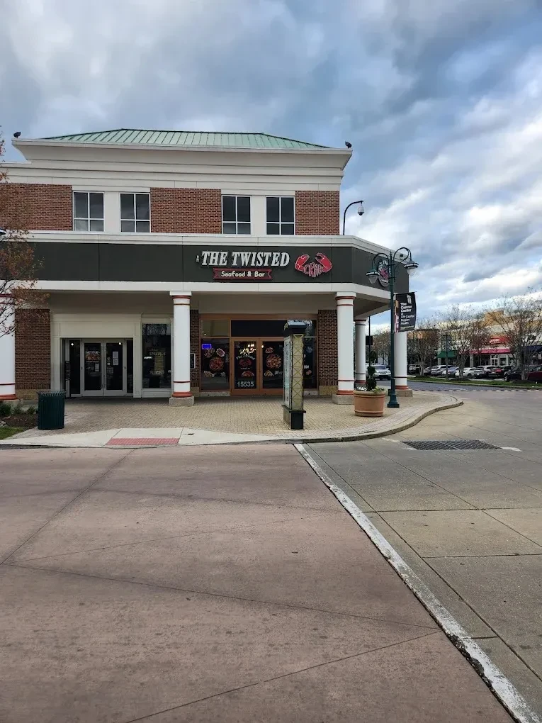 The Twisted Crab Seafood & Bar: two-story red brick and dark facade.