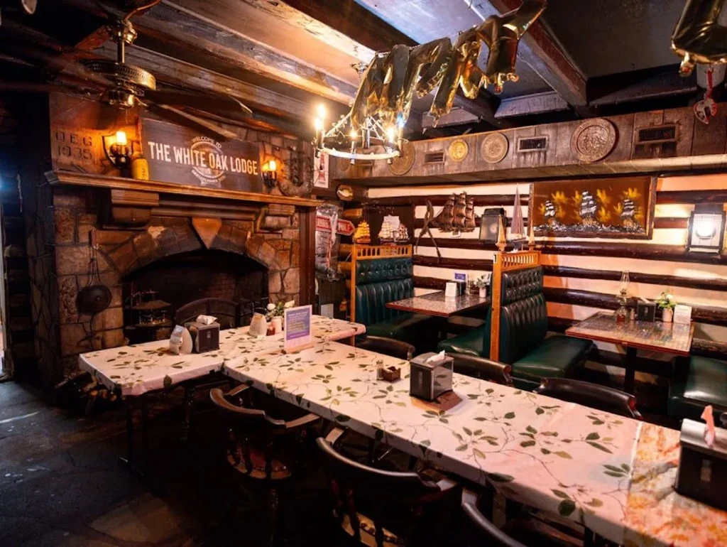 The White Oak Lodge's rustic dining room with communal table and nautical decor.