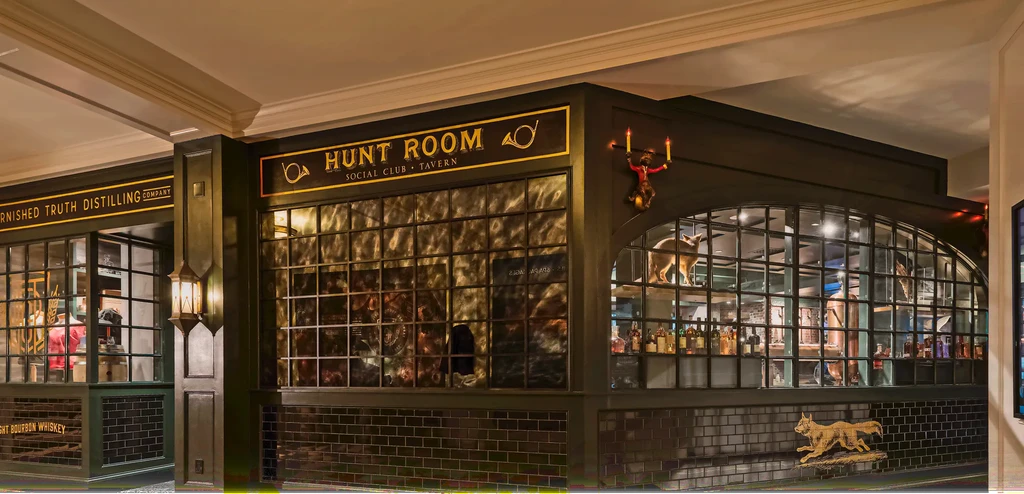 Dark facade of Hunt Room Social Club and Burnished Truth Distillery.