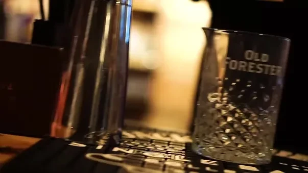 Close-up of Old Forester diamond-cut mixing glass and shaker.