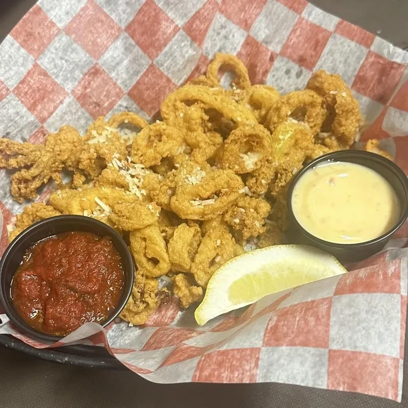 Crispy fried calamari with marinara sauce, creamy dip, and lemon.