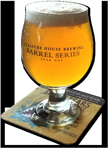 Pleasure House Brewing beer in a tulip glass on a shark coaster.