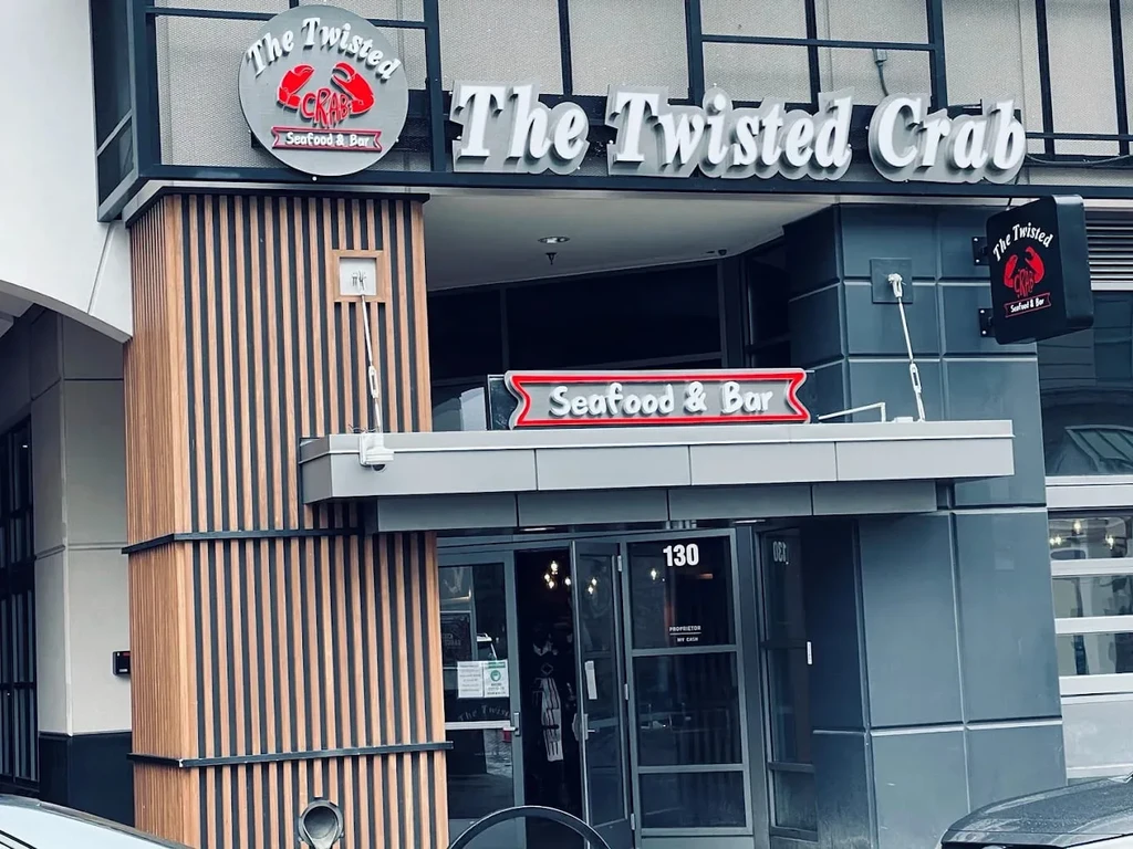 Modern exterior of The Twisted Crab Seafood & Bar restaurant.
