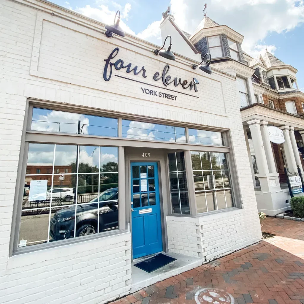 White brick storefront for "four eleven YORK STREET" on a sunny day.