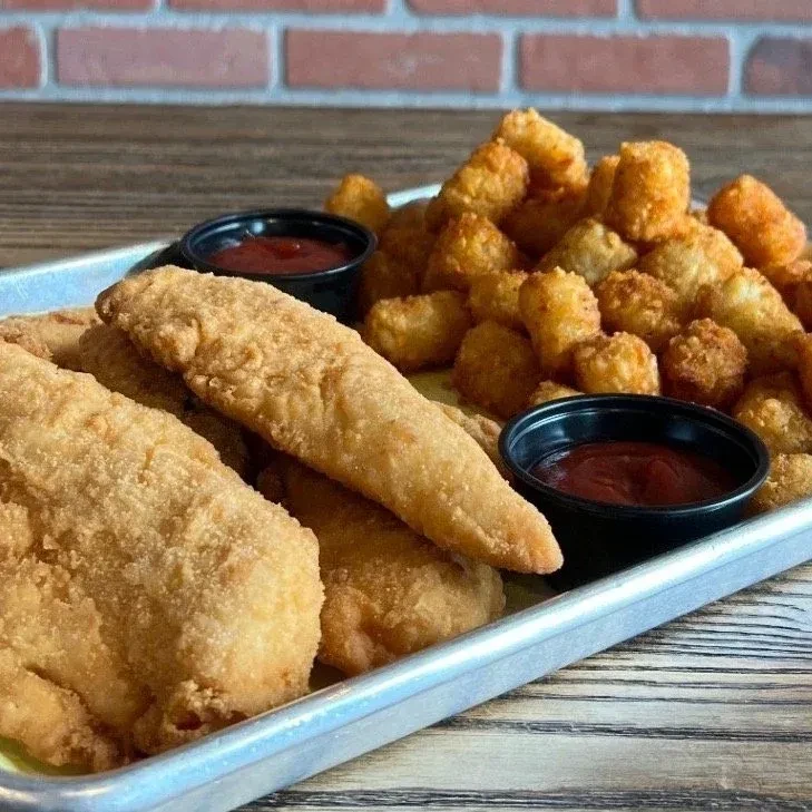 Crispy fried tenders, tater tots, and ketchup on a metal tray.