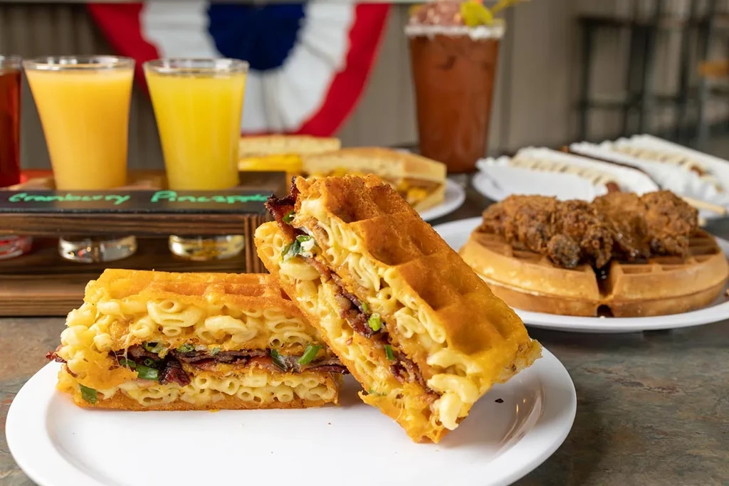 Crispy waffle sandwich, chicken and waffles, juice flight, Bloody Mary.