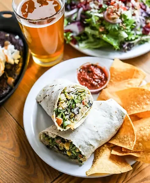 Wrap cut in half with tortilla chips, salsa, salad and beer