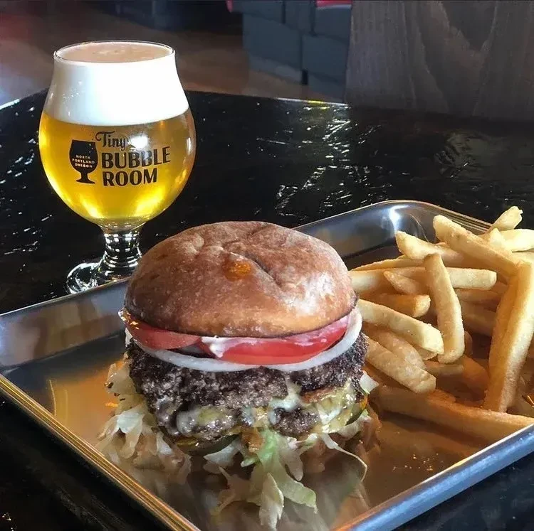Double cheeseburger, french fries, and a Tiny Bubble Room beer.