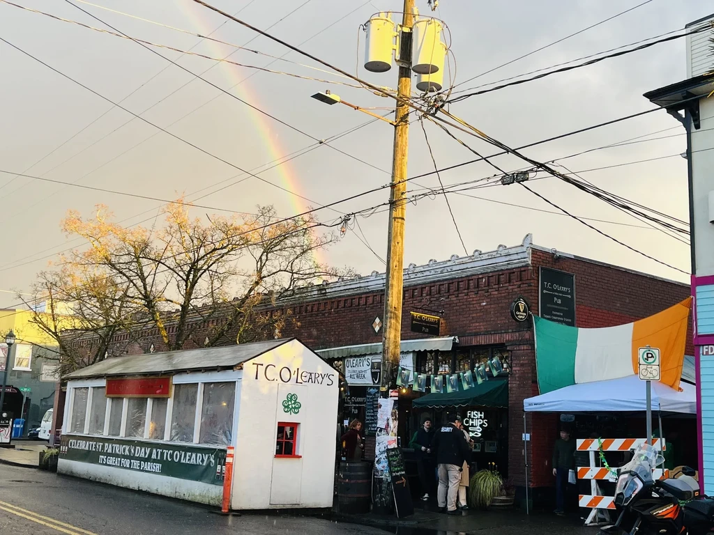 T.C. O'Leary's Irish pub, St. Patrick's Day tent, and a prominent rainbow.