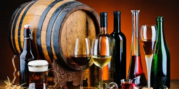 Still-life with beer, wine, spirits, glasses, and a wooden barrel.