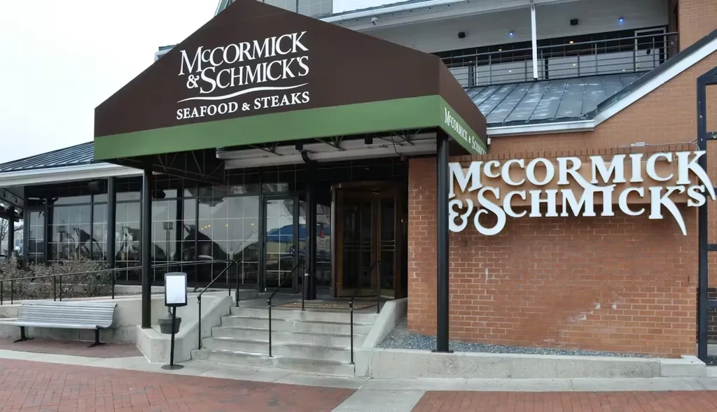 McCormick & Schmick's restaurant exterior, entrance with awning and accessibility ramp.