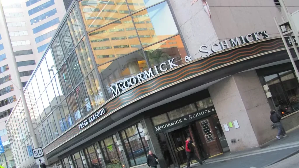 McCormick & Schmick's restaurant, large glass windows, and "FRESH SEAFOOD" sign.