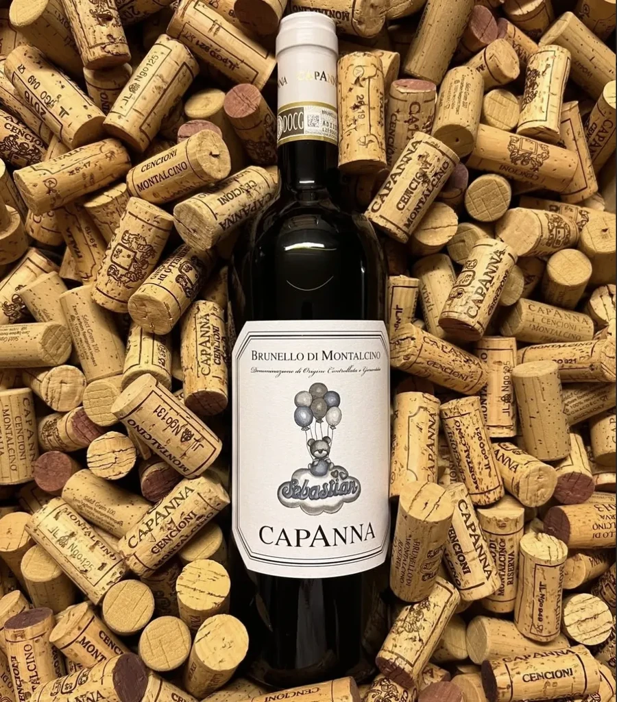 Brunello wine bottle with teddy bear label surrounded by many corks.