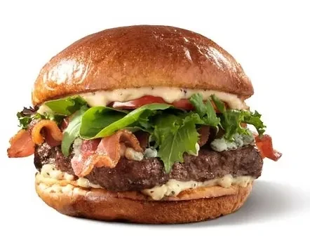 Double-patty burger with bacon, blue cheese, lettuce, tomato on white.