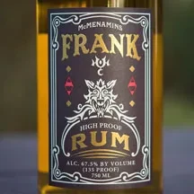 McMenamins FRANK 135 Proof Rum label with a white wolf head.