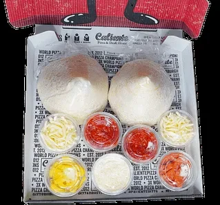 Caliente Pizza make-your-own kit with dough balls and various toppings.
