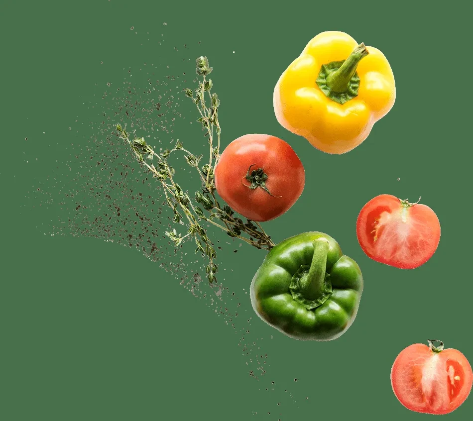 Fresh yellow, green peppers, red tomatoes, and thyme float on dark green.