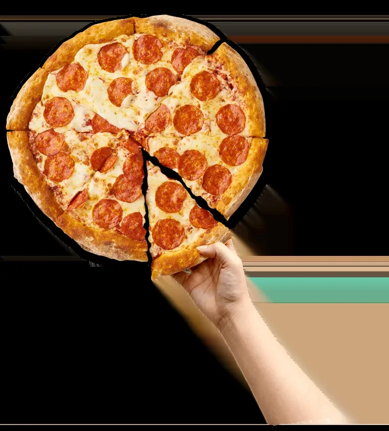 A hand lifts a slice of a round pepperoni pizza.