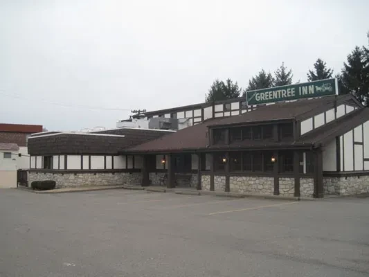 Exterior of Greentree Inn, a pseudo-Tudor stone and timber building.
