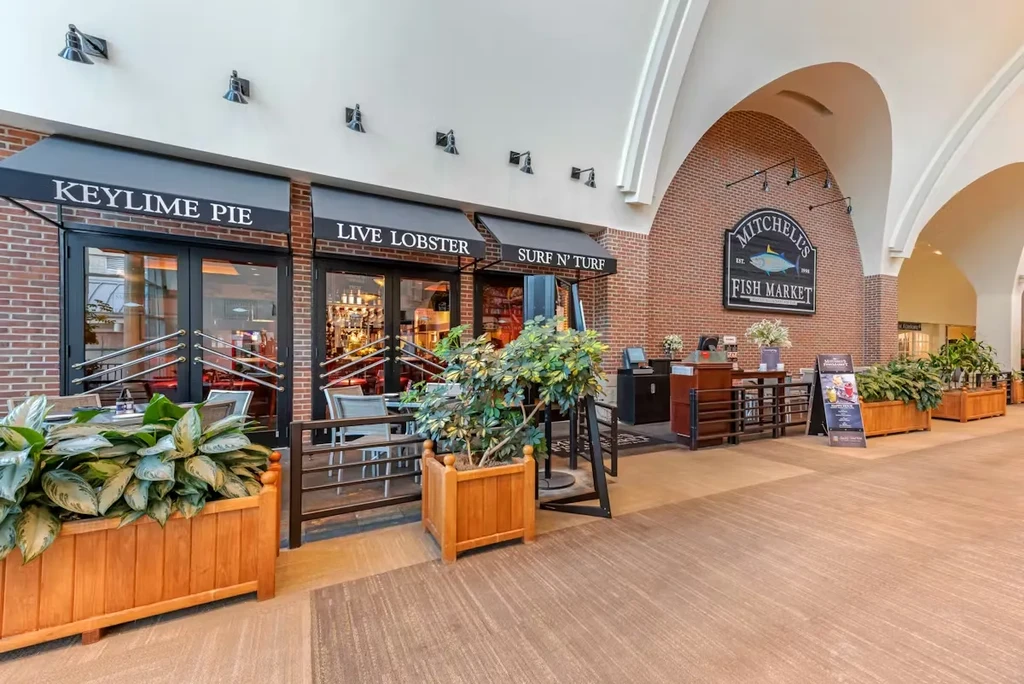 Mitchell's Fish Market exterior in an indoor mall, with awnings and seating.