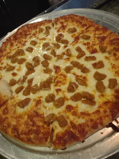 Freshly baked sausage pizza with golden cheese and crispy crust.