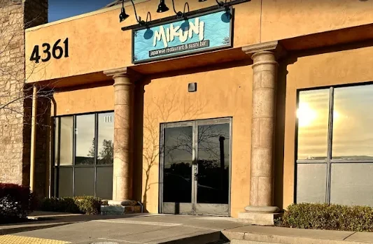 Mikuni Japanese Restaurant exterior: sandy-yellow stucco, teal sign, address 4361.
