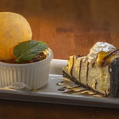 Two desserts: a crème brûlée and a chocolate banana cheesecake.