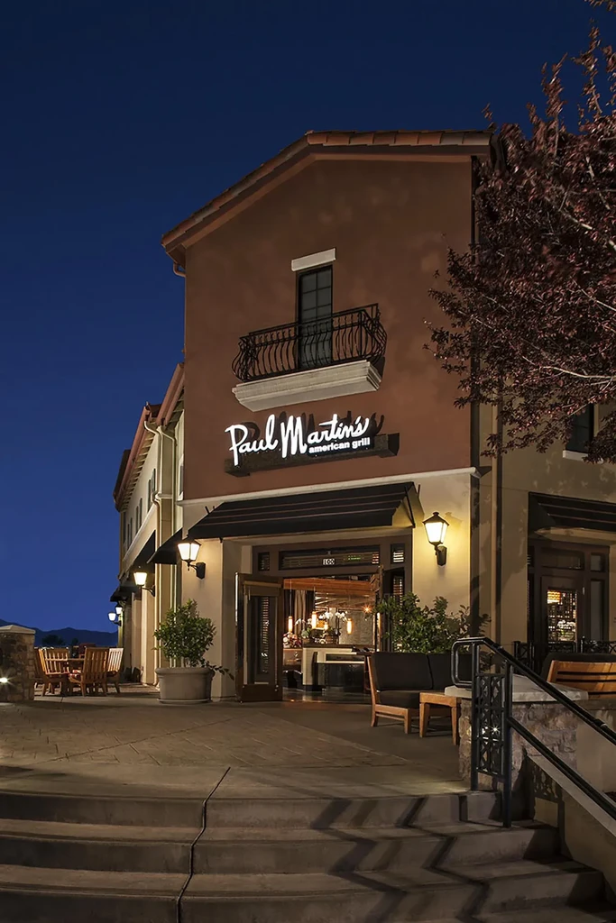 Paul Martin's American Grill: Mediterranean-style restaurant building lit up at night.