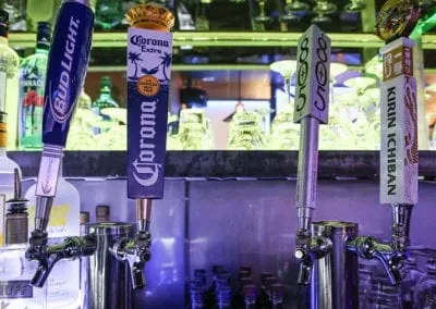 Bud Light, Corona Extra, 805, Kirin Ichiban beer taps at a bar.