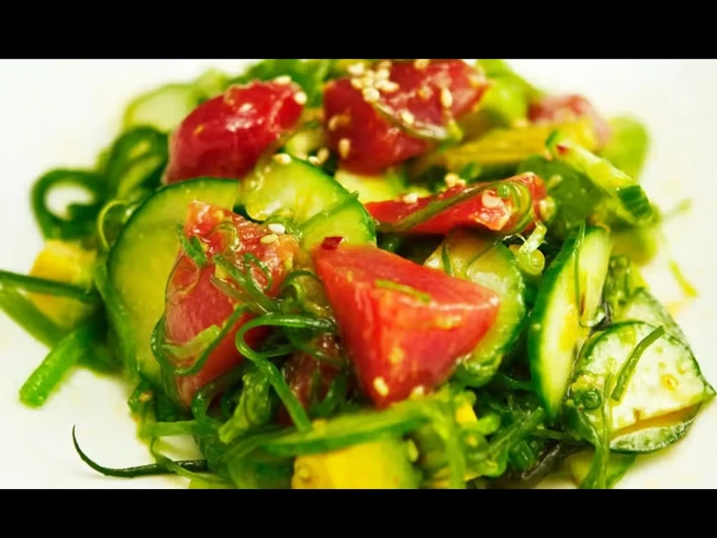 Poke-style dish with diced red, green cucumber, seaweed, sesame.