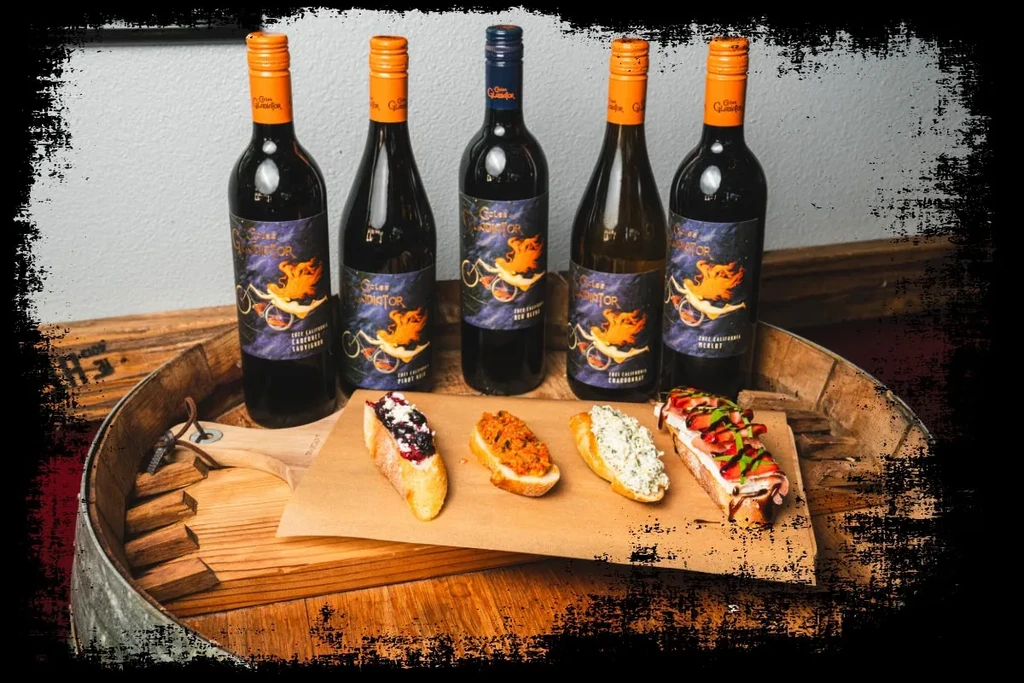 Five Girasol Gladiator wines and four gourmet appetizers on a wine barrel.