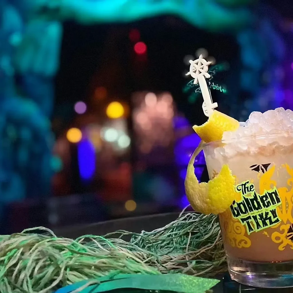 The Golden Tiki cocktail, crushed ice, citrus peel, ship's wheel stirrer.