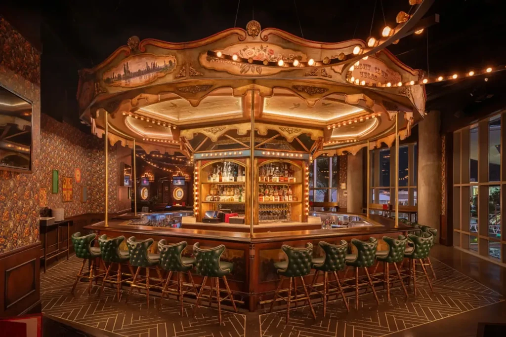 Ornate octagonal bar, carousel-like and lit, with green stools and city view.